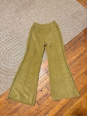 BDG olive green corduroy flare pants with contrasting green piping down the legs